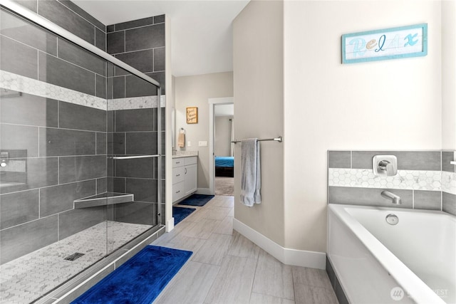 3 Kingfisher Rd, Twisp, WA 98856 - bathroom with a bath, baseboards, a stall shower, connected bathroom, and vanity