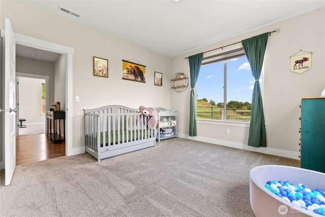 3 Kingfisher Rd, Twisp, WA 98856 - bedroom with carpet, baseboards, and a crib