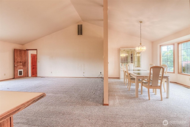 703 Tanarae Pl, Yakima, WA 98908 - dining area featuring carpet floors, a chandelier, heating unit, and high vaulted ceiling