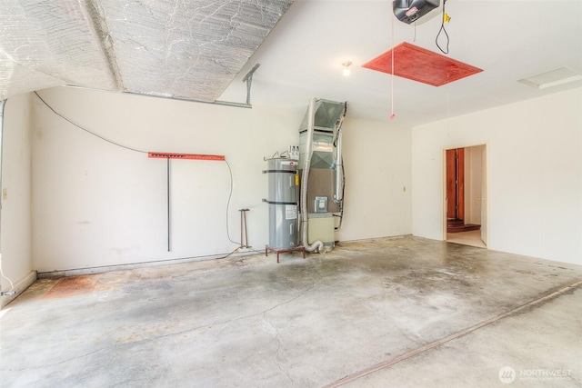 703 Tanarae Pl, Yakima, WA 98908 - garage featuring a garage door opener, strapped water heater, and heating unit
