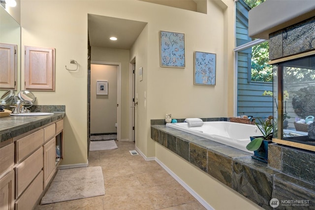 9042 Gleneagle Dr, Blaine, WA 98230 - bathroom featuring a bath, vanity, and tile patterned floors