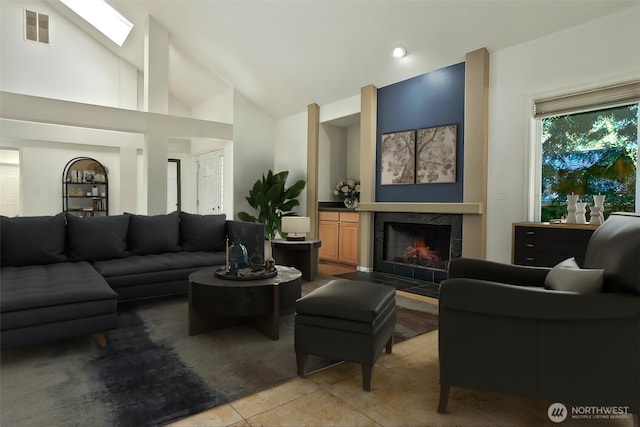 9042 Gleneagle Dr, Blaine, WA 98230 - living area featuring a fireplace, light tile patterned floors, and high vaulted ceiling