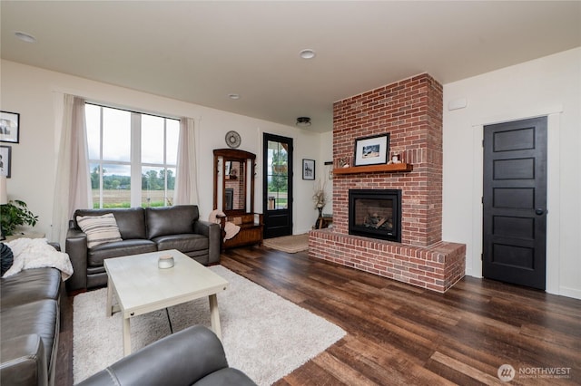 515 Mitchell St, Sumas, WA 98295 - living room with dark wood finished floors and a brick fireplace