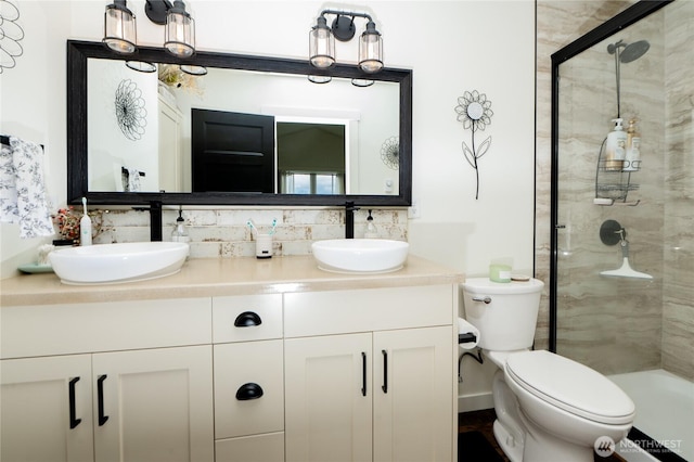 515 Mitchell St, Sumas, WA 98295 - bathroom with a shower stall, double vanity, toilet, and backsplash
