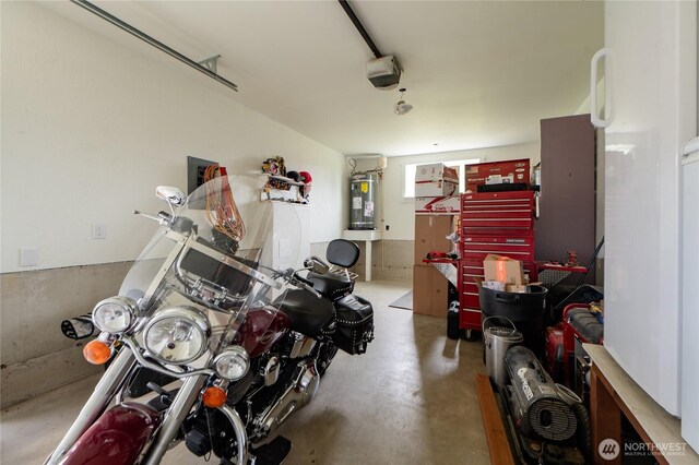 515 Mitchell St, Sumas, WA 98295 - garage featuring water heater and a garage door opener