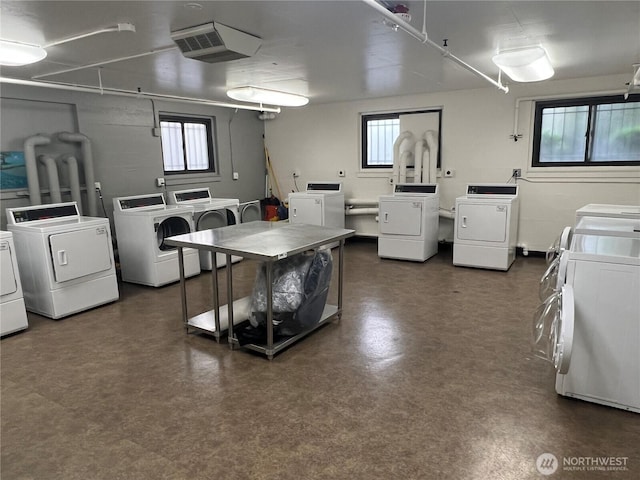 1105 Spring Unit 1309, Seattle, WA 98104 - shared laundry room featuring washing machine and clothes dryer