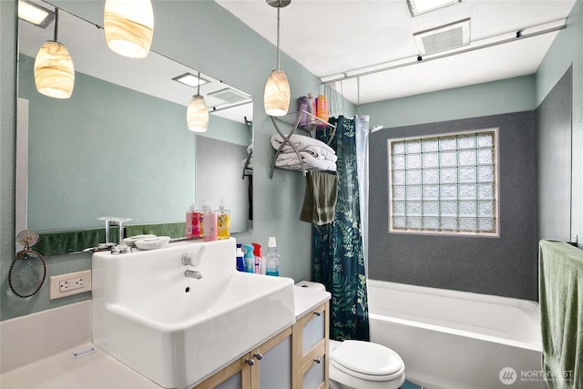 7431 S 132nd St, Seattle, WA 98178 - bathroom featuring vanity, toilet, and shower / bathtub combination with curtain
