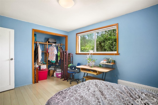 7431 S 132nd St, Seattle, WA 98178 - bedroom with wood finished floors, radiator heating unit, and a closet