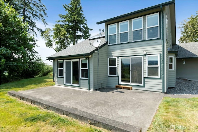 21806 168th St E, Orting, WA 98360 - back of house featuring a patio area, a lawn, and roof with shingles