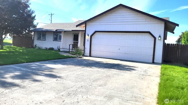 390 4th Ave SE, Ephrata, WA 98823 - single story home with concrete driveway and a garage