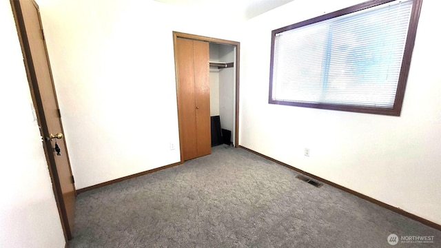 390 4th Ave SE, Ephrata, WA 98823 - unfurnished bedroom featuring carpet, baseboards, and a closet