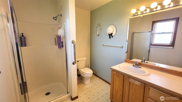 390 4th Ave SE, Ephrata, WA 98823 - bathroom with a stall shower, tile patterned floors, vanity, and toilet