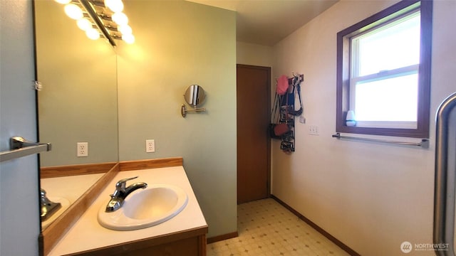 390 4th Ave SE, Ephrata, WA 98823 - bathroom with tile patterned floors, vanity, and baseboards