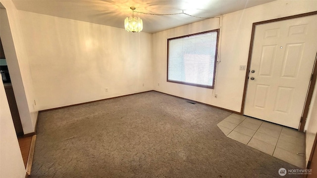 390 4th Ave SE, Ephrata, WA 98823 - carpeted foyer featuring a chandelier and baseboards
