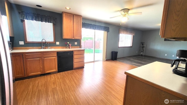 390 4th Ave SE, Ephrata, WA 98823 - kitchen with dishwasher, a sink, light wood finished floors, light countertops, and a ceiling fan