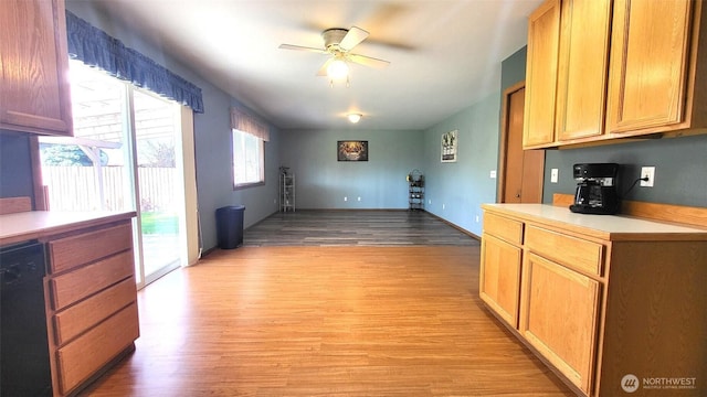 390 4th Ave SE, Ephrata, WA 98823 - kitchen featuring light wood-style flooring, black dishwasher, ceiling fan, and light countertops
