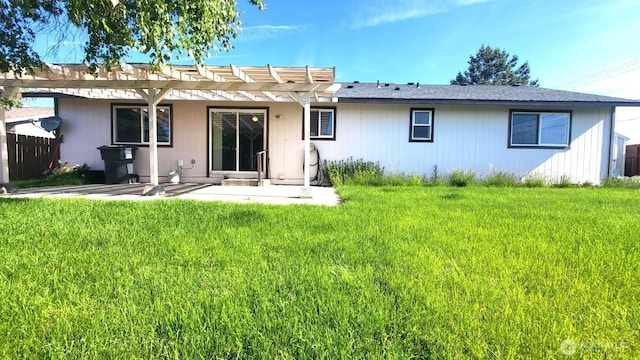 390 4th Ave SE, Ephrata, WA 98823 - back of property with a pergola, a patio area, and a lawn