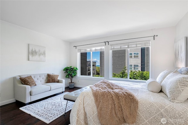 613 4th Ave W Unit 202, Seattle, WA 98119 - bedroom with dark wood-style flooring and baseboards
