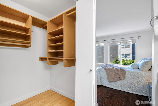 613 4th Ave W Unit 202, Seattle, WA 98119 - bedroom with wood finished floors and baseboards