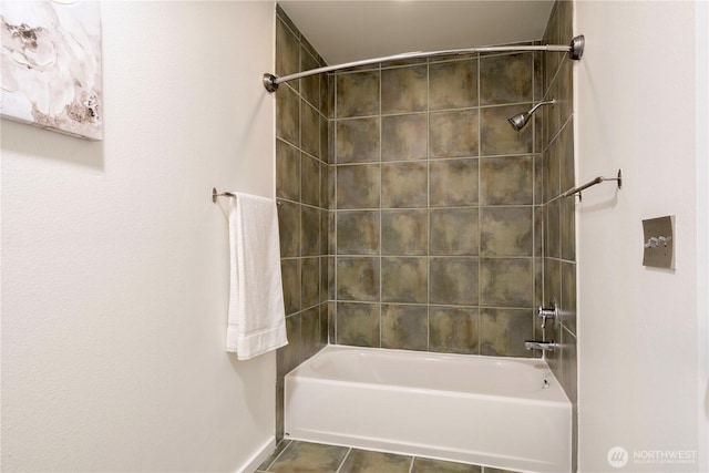 613 4th Ave W Unit 202, Seattle, WA 98119 - bathroom featuring tile patterned floors and washtub / shower combination