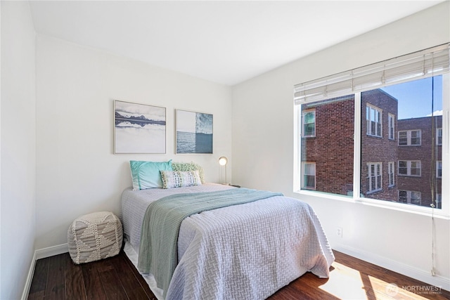 613 4th Ave W Unit 202, Seattle, WA 98119 - bedroom featuring baseboards and wood finished floors