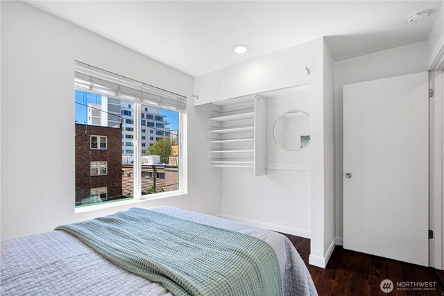 613 4th Ave W Unit 202, Seattle, WA 98119 - bedroom featuring baseboards, wood finished floors, and recessed lighting