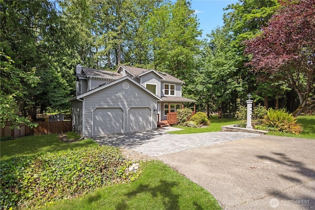 2021 224th Pl NE, Sammamish, WA 98074 - traditional home with a garage, driveway, and a chimney