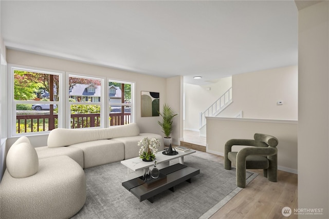 2021 224th Pl NE, Sammamish, WA 98074 - living room with wood finished floors, baseboards, and stairway