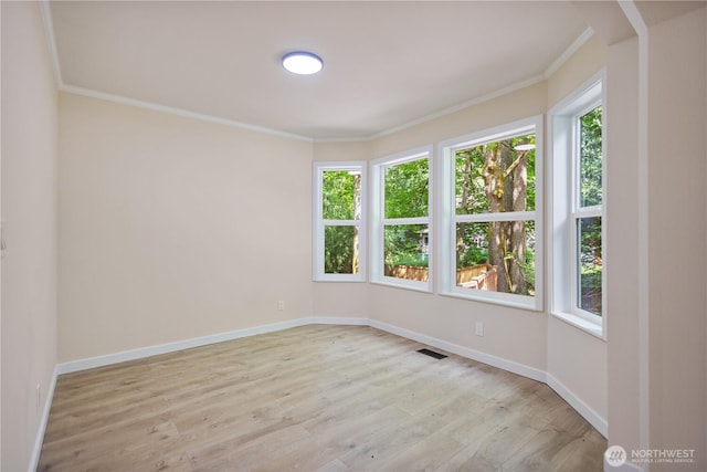 2021 224th Pl NE, Sammamish, WA 98074 - empty room featuring ornamental molding, light wood-type flooring, and baseboards