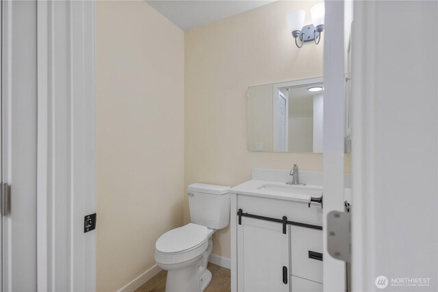 2021 224th Pl NE, Sammamish, WA 98074 - half bathroom featuring vanity, toilet, and baseboards
