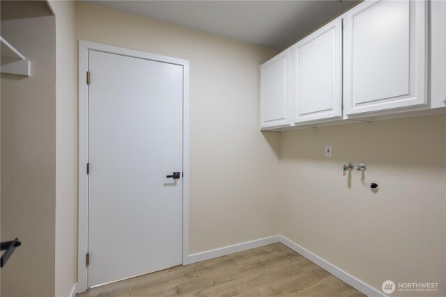 2021 224th Pl NE, Sammamish, WA 98074 - laundry area featuring cabinet space, light wood-style floors, baseboards, and washer hookup