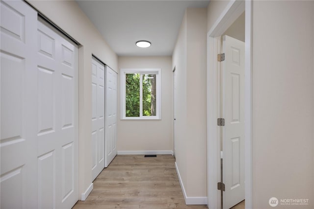 2021 224th Pl NE, Sammamish, WA 98074 - corridor featuring light wood-style flooring and baseboards
