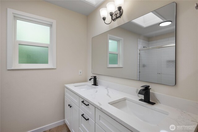 2021 224th Pl NE, Sammamish, WA 98074 - bathroom featuring healthy amount of natural light, double vanity, tiled shower, and a skylight
