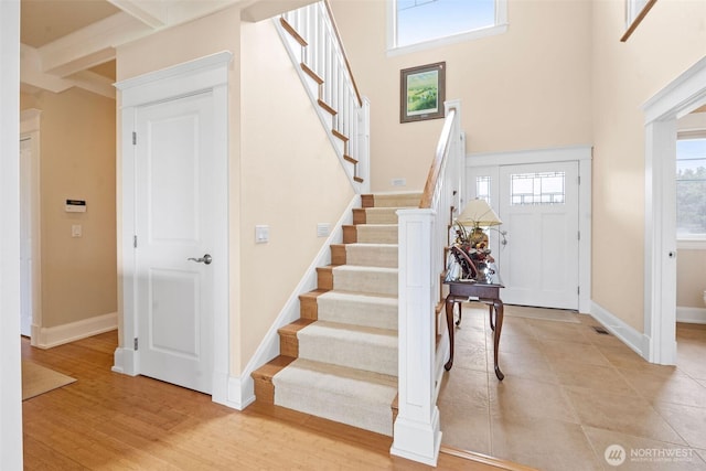 234 26th St NW, Long Beach, WA 98631 - foyer entrance with stairway, baseboards, and a towering ceiling