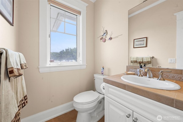 234 26th St NW, Long Beach, WA 98631 - half bathroom featuring toilet, vanity, and tile patterned flooring