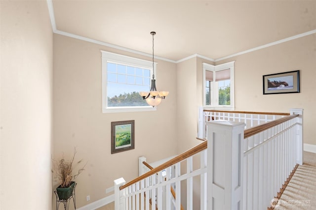 234 26th St NW, Long Beach, WA 98631 - hallway featuring an upstairs landing, a chandelier, baseboards, and crown molding