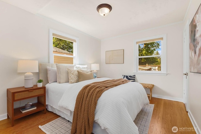 1214 NE 98th St, Seattle, WA 98115 - bedroom with ornamental molding, wood finished floors, and baseboards