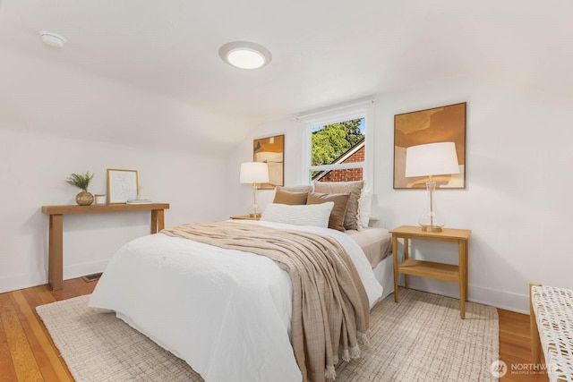 1214 NE 98th St, Seattle, WA 98115 - bedroom with light wood-style floors and lofted ceiling