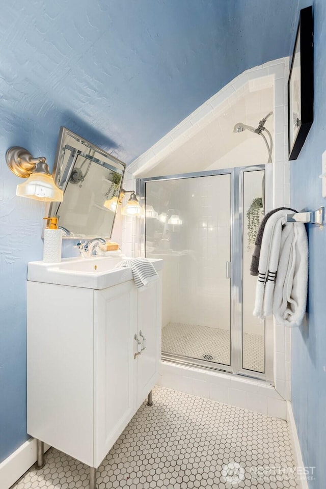 1214 NE 98th St, Seattle, WA 98115 - full bath with a shower stall, tile patterned flooring, vanity, and baseboards