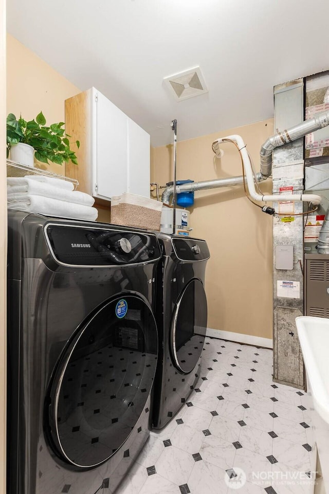 1214 NE 98th St, Seattle, WA 98115 - laundry room with cabinet space, independent washer and dryer, and baseboards