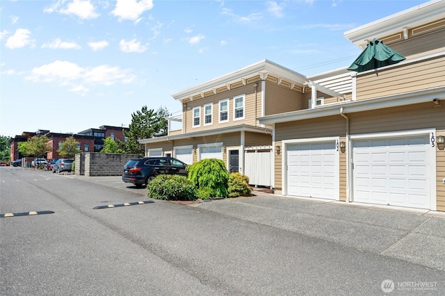 1310 Old Fairhaven Pkwy Unit 102, Bellingham, WA 98225 - view of front of property with a garage and asphalt driveway