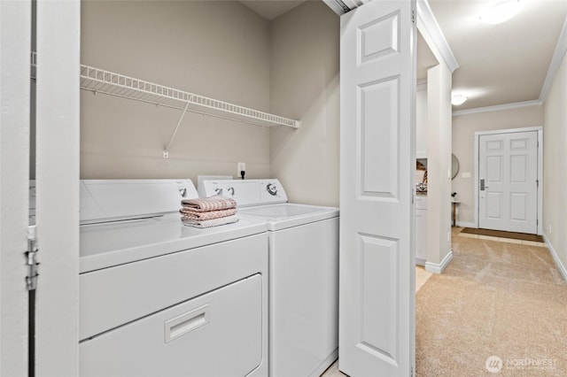 1310 Old Fairhaven Pkwy Unit 102, Bellingham, WA 98225 - laundry room with washer and clothes dryer, light colored carpet, baseboards, and crown molding