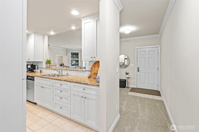 1310 Old Fairhaven Pkwy Unit 102, Bellingham, WA 98225 - kitchen with a sink, dishwasher, ornamental molding, white cabinetry, and decorative backsplash