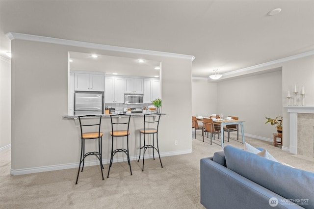 1310 Old Fairhaven Pkwy Unit 102, Bellingham, WA 98225 - living room with light colored carpet, ornamental molding, baseboards, and recessed lighting