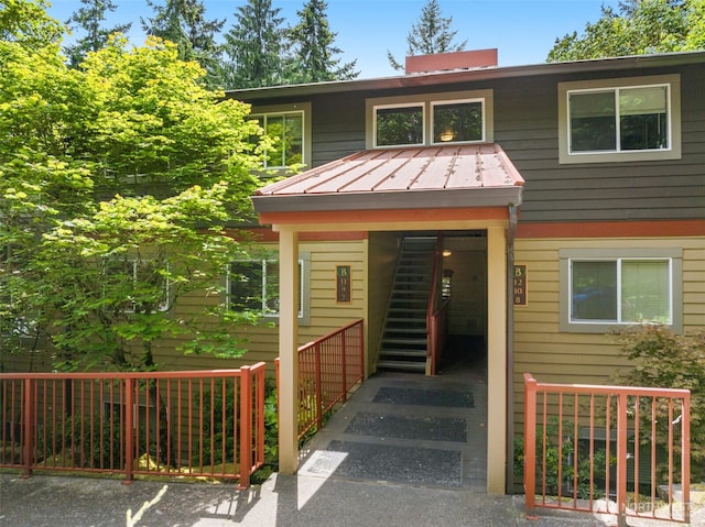 11058 NE 33rd Pl Unit B9, Bellevue, WA 98004 - view of front of home with stairs, a standing seam roof, and metal roof
