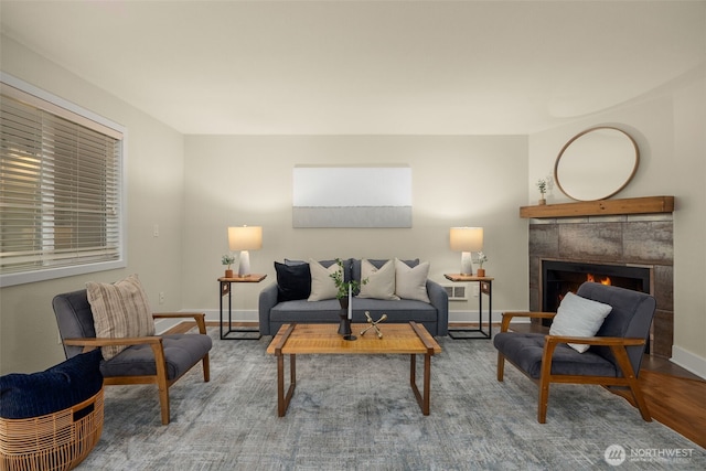11058 NE 33rd Pl Unit B9, Bellevue, WA 98004 - living area featuring a tile fireplace, baseboards, and wood finished floors