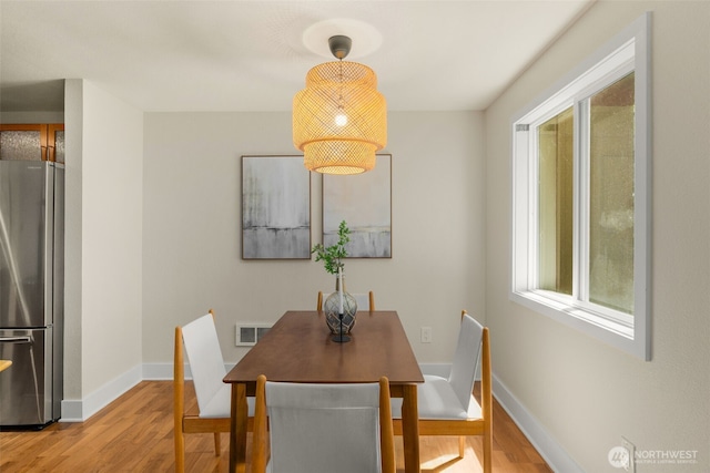 11058 NE 33rd Pl Unit B9, Bellevue, WA 98004 - dining room featuring wood finished floors and baseboards