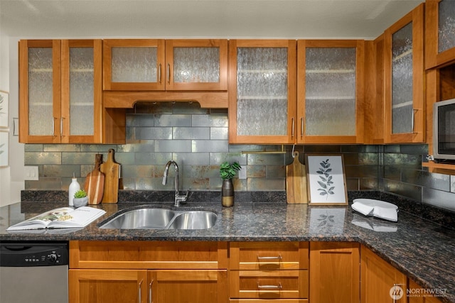 11058 NE 33rd Pl Unit B9, Bellevue, WA 98004 - kitchen featuring stainless steel dishwasher, a sink, tasteful backsplash, dark stone counters, and brown cabinetry