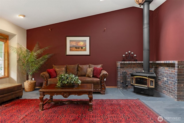3220 N Pacific Ave, Kelso, WA 98626 - carpeted living room featuring a wood stove and lofted ceiling