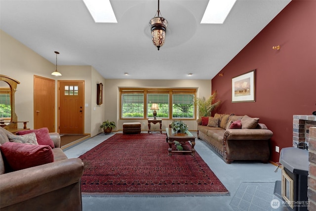 3220 N Pacific Ave, Kelso, WA 98626 - living room with a skylight, carpet flooring, a wood stove, and vaulted ceiling